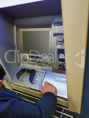 Woman at an ATM cash machine.