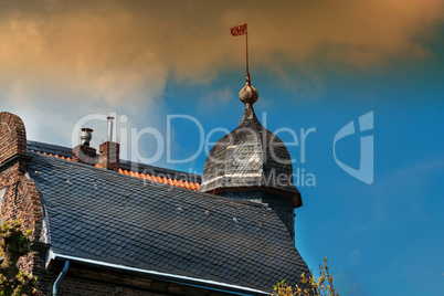 Detail of a house view with weather vane