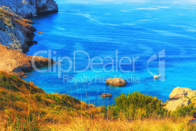 Picturesque sea landscape with bay and sailing ship