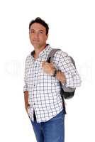 Young man standing with his backpack