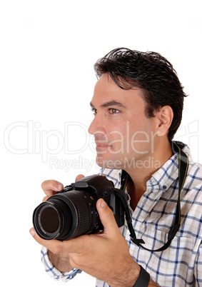 A handsome man holding his camera ready for a shoot