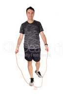 Man exercising in the studio with his rope