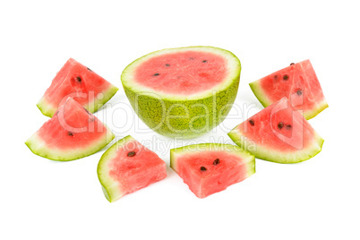 Ripe round watermelon and half a berry isolated on white .