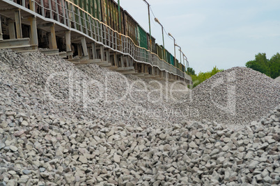 Railway. Transportation of crushed stone by rail. Unloading railway platform.