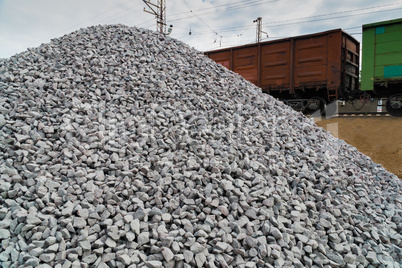 Railway. Transportation of crushed stone by rail. Unloading railway platform.
