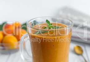 Smoothie of ripe apricots in a glass Cup.