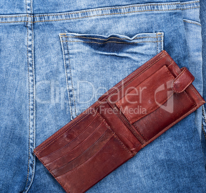 open empty brown leather wallet
