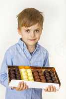 Boy with box of confectionery