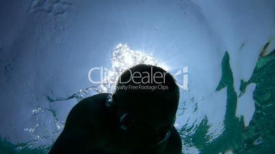 Man Swimming Underwater Or Swimmer Free Diving In Sea Water