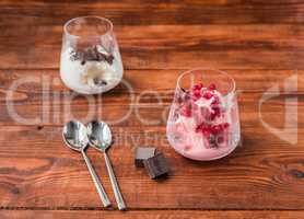 Two portions of vanilla and strawberry ice cream in glass