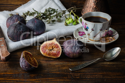 Cup of coffee with juicy figs for dessert