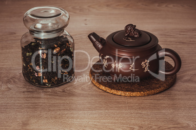 Asian teapot on stand and jar