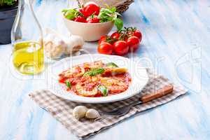 Delicious pasta - ravioli in tomato sauce with basil