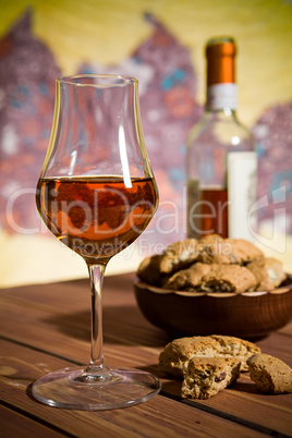 Closeup of a glass of Italian vin santo wine and cantucci biscui