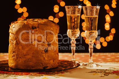 Italian panettone and sparkling wine over a table