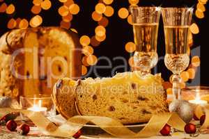 Sliced italian panettone and sparkling wine
