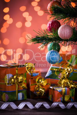 Christmas gifts with blurred lights and ribbon
