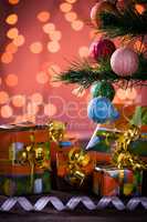 Christmas gifts with blurred lights and ribbon