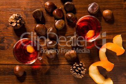 Alcoholic punch drink, chestnuts and pine cone