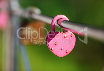 Closed pink padlock