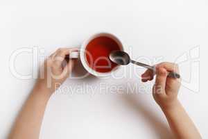 Hands with cup of tea