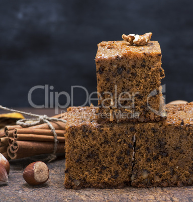 three baked piece of cake sponge with nuts