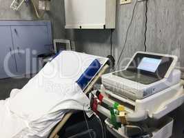 bed and medical equipment in a public emergency room
