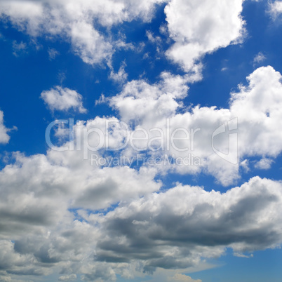 Light cumulus clouds in the blue sky.