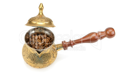 Coffeepot and coffee beans isolated on white background.