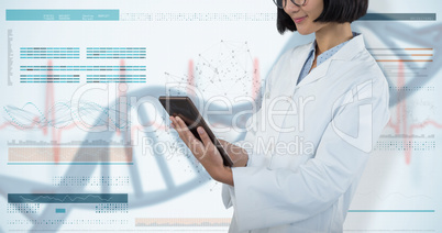Composite image of doctor using digital tablet against white background
