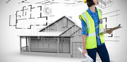 Composite image of female architect holding clipboard and blueprint against grey background