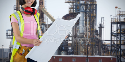 Composite image of female architect holding blueprint against white background