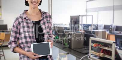 Composite image of smiling woman showing digital tablet against white background