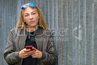 Pretty Blonde Girl Teenager Using Smart Phone