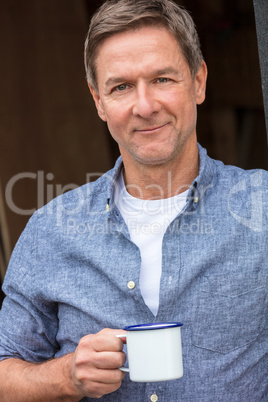 Happy Middle Aged Man Drinking Tea or Coffee Outside