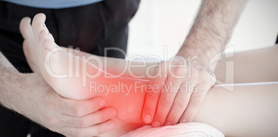 Composite image of young woman enjoying a foot massage
