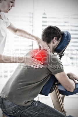 Composite image of therapist massaging in hospital Composite image of therapist massaging in hospital