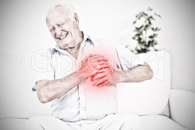 Composite image of old man suffering with heart pain