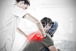 Composite image of physiotherapist giving back massage to man