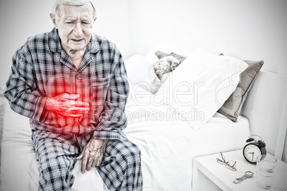 Composite image of elderly man suffering with belly pain