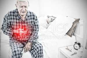 Composite image of elderly man suffering with belly pain