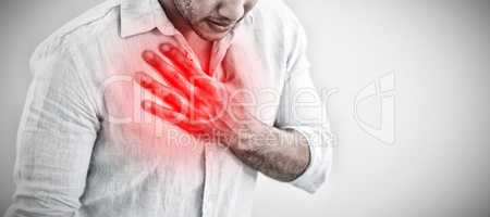 Composite image of casual young man with chest pain