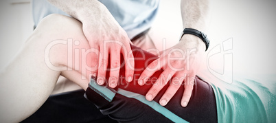 Composite image of therapist doing fitness exercises with a woman
