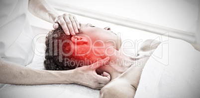 Composite image of woman receiving neck massage in spa