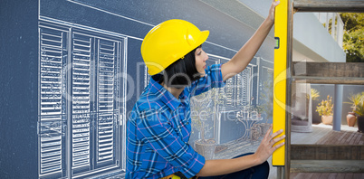 Composite image of female architect measuring plywood with engineer scale