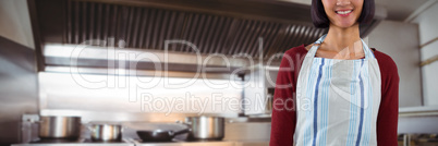 Composite image of smiling waitress in apron standing against white background