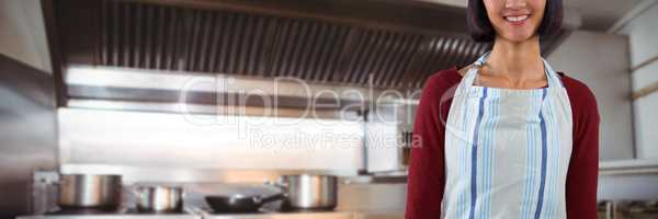 Composite image of smiling waitress in apron standing against white background