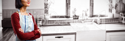 Composite image of waitress standing with arms crossed against white background