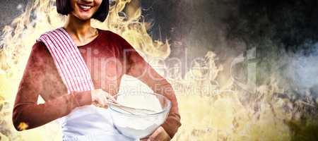 Composite image of smiling female chef mixing flour in bowl with whisk