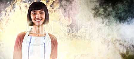Composite image of smiling waitress in apron standing against white background